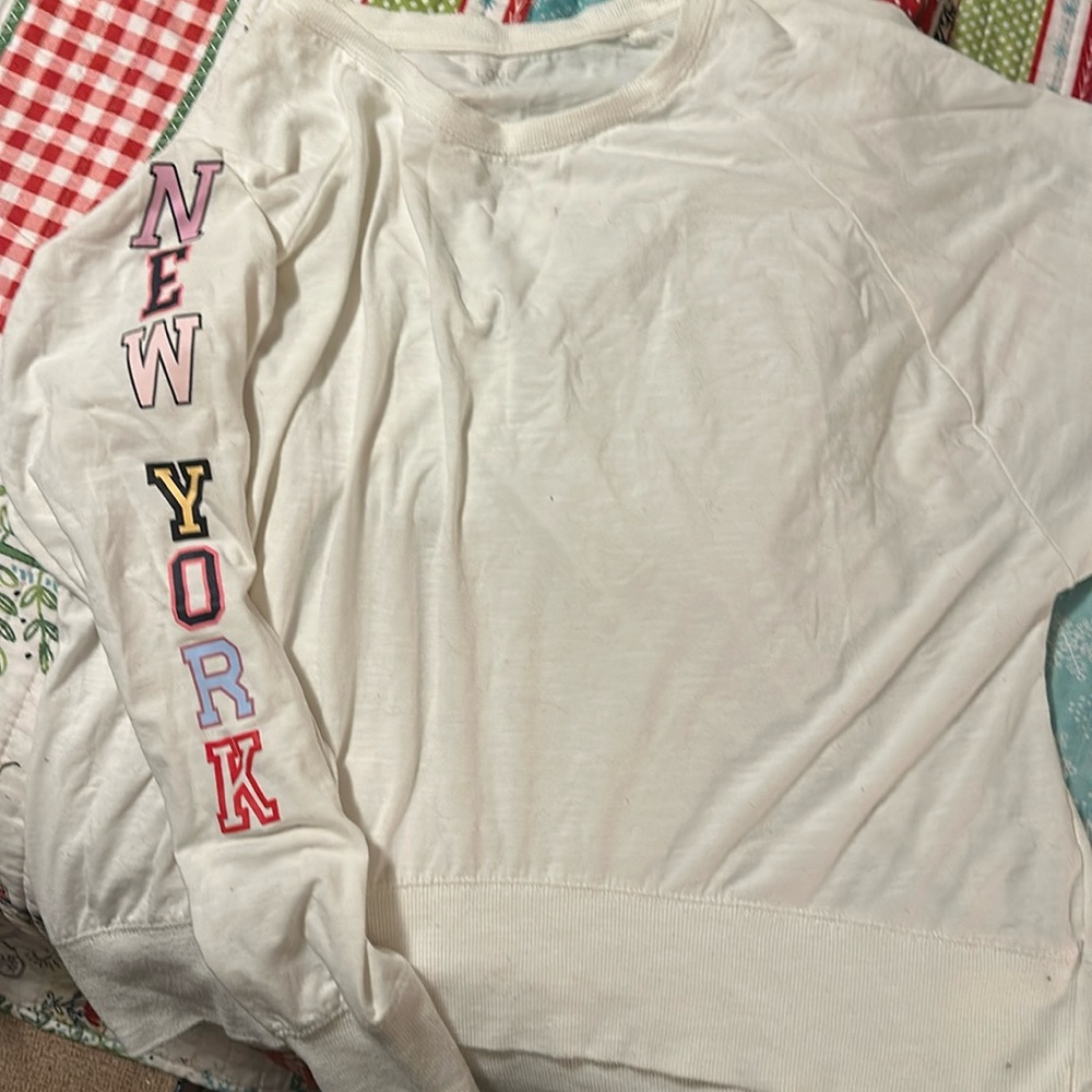 Long sleeve cream shirt women’s.  Loose fitting.